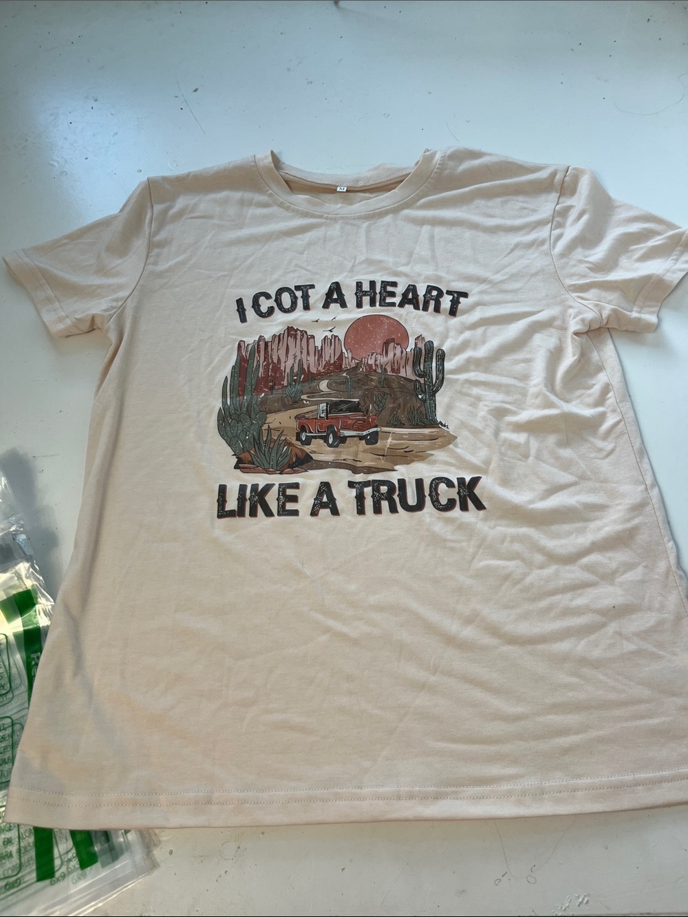 Amazon Medium I Got A Heart Like A Truck Short Sleeve Beige Graphic T Shirt